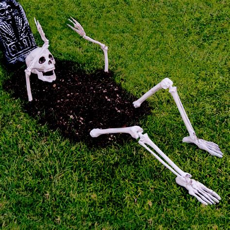 funny skeleton yard decorations|skeleton crawling out of ground.